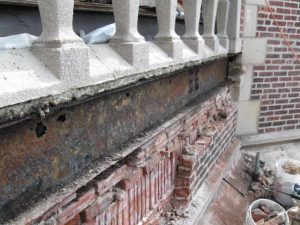 Exposed steel beam, showing holes in web due to corrosion